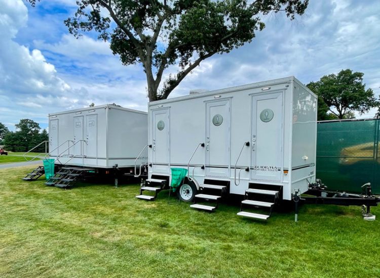 High-quality portable restroom trailer with multiple stalls for outdoor events in NY & NJ